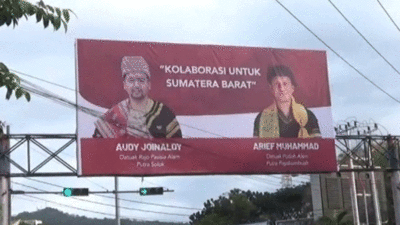 Baliho Audy dan Arief Muhammad.