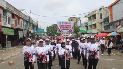 Peserta pawai pembangunan di Bungo. (bungokab.go,.id)